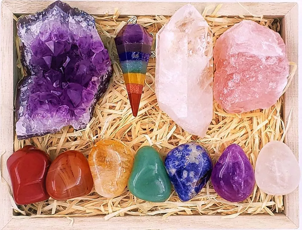 Premium collection of witchcraft crystals including amethyst geode, clear quartz, rose quartz, and chakra stones – essential witch crystals and gems for any practitioner.